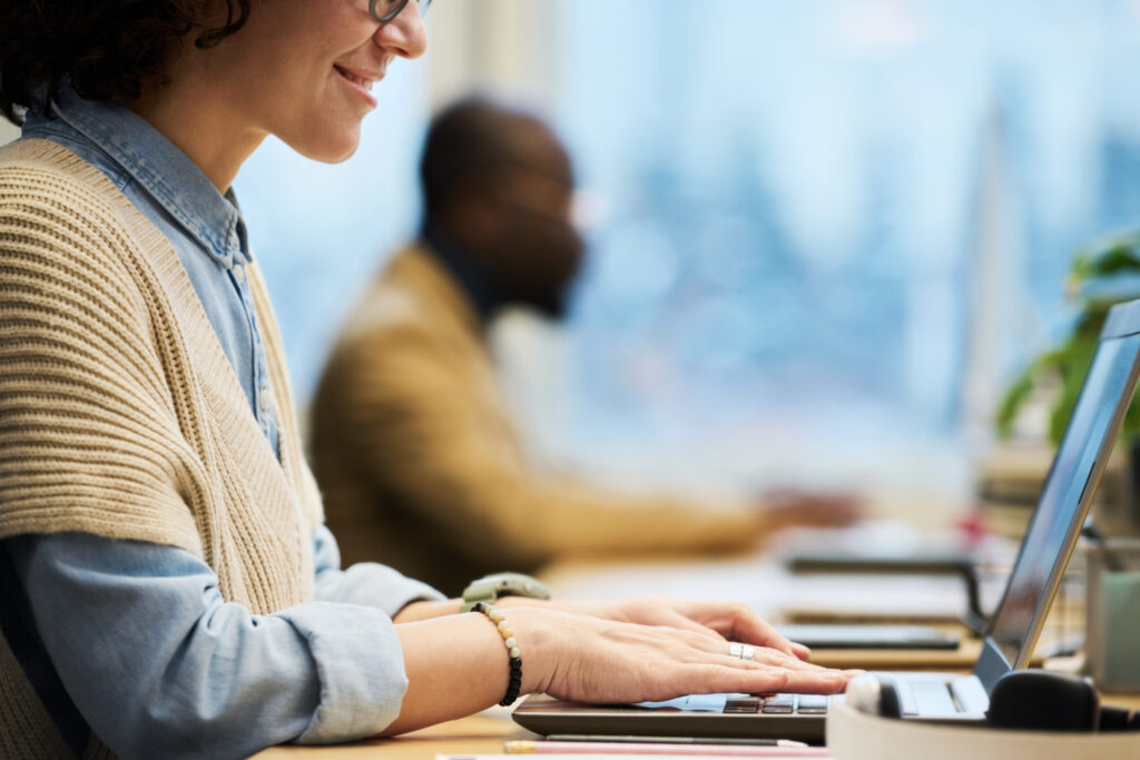 Girl working with Nectain Document Management system in office on Mac